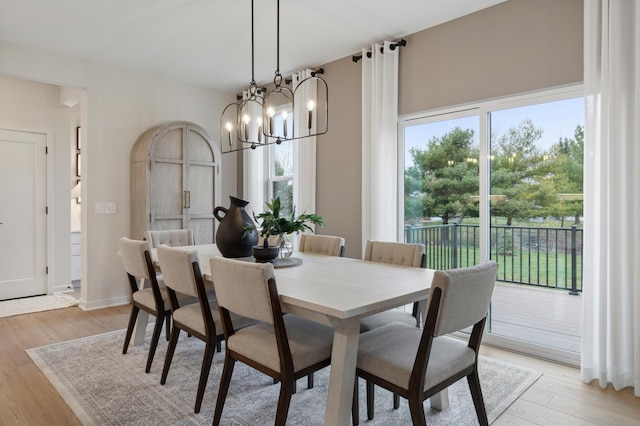 14625 105th Pl N, Maple Grove, MN 55369 - dining room featuring light wood-style flooring and a chandelier