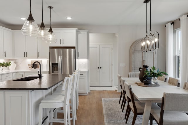 14625 105th Pl N, Maple Grove, MN 55369 - dining room with a chandelier, light wood-style flooring, and recessed lighting