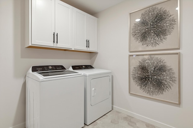 14625 105th Pl N, Maple Grove, MN 55369 - laundry room featuring washing machine and clothes dryer, cabinet space, and light marble finish flooring