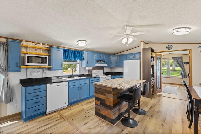 4799 Bridgewater Rd, Fair Haven Twp, MN 55382 - kitchen featuring white appliances, blue cabinets, open shelves, a textured ceiling, and light wood finished floors