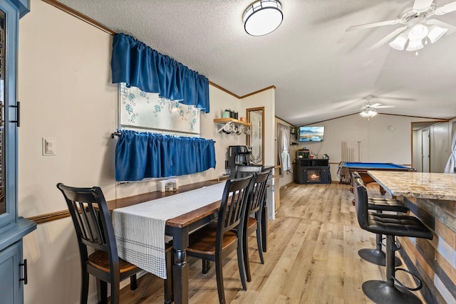4799 Bridgewater Rd, Fair Haven Twp, MN 55382 - dining room featuring ceiling fan, crown molding, light wood-style flooring, lofted ceiling, and a textured ceiling