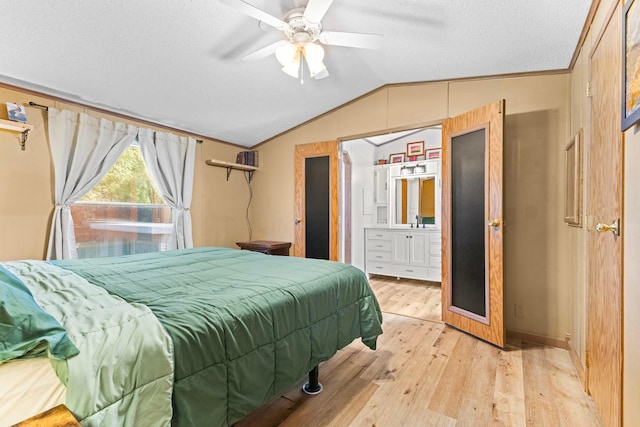 4799 Bridgewater Rd, Fair Haven Twp, MN 55382 - bedroom with lofted ceiling, light wood finished floors, a textured ceiling, ensuite bathroom, and a ceiling fan
