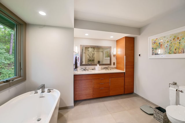 N7775 920th St, River Falls, WI 54022 - full bathroom featuring a freestanding tub, double vanity, tile patterned floors, recessed lighting, and a shower