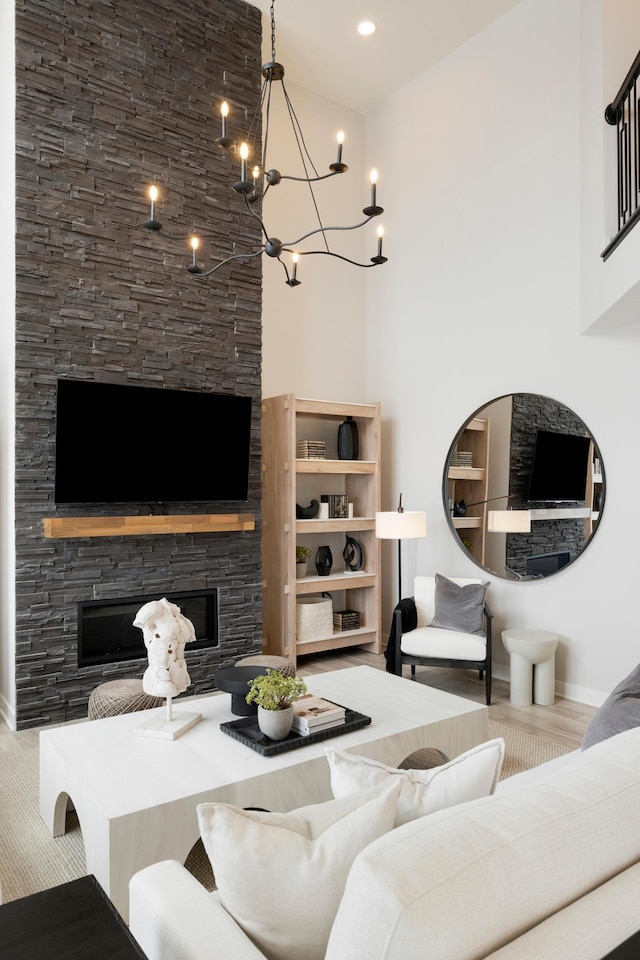 14705 105th Pl N, Maple Grove, MN 55369 - living room with a fireplace, a chandelier, and baseboards