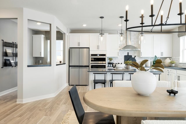 14705 105th Pl N, Maple Grove, MN 55369 - kitchen featuring appliances with stainless steel finishes, baseboards, decorative backsplash, white cabinets, and recessed lighting
