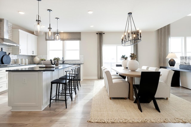 14705 105th Pl N, Maple Grove, MN 55369 - dining space with light wood-type flooring, a chandelier, recessed lighting, and baseboards