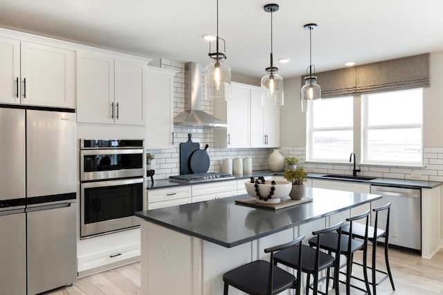 14705 105th Pl N, Maple Grove, MN 55369 - kitchen featuring stainless steel appliances, a sink, wall chimney range hood, dark countertops, and recessed lighting