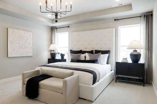 14705 105th Pl N, Maple Grove, MN 55369 - bedroom featuring light colored carpet, baseboards, and a chandelier