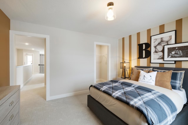 14705 105th Pl N, Maple Grove, MN 55369 - bedroom with light carpet, baseboards, wallpapered walls, a walk in closet, and a closet