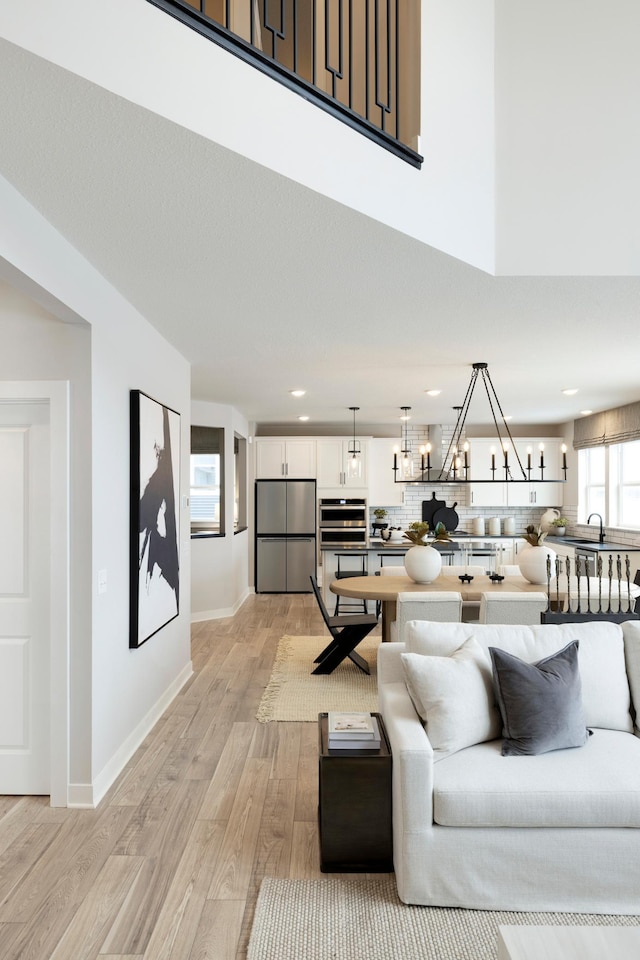 14705 105th Pl N, Maple Grove, MN 55369 - living room with light wood-type flooring, recessed lighting, and a chandelier