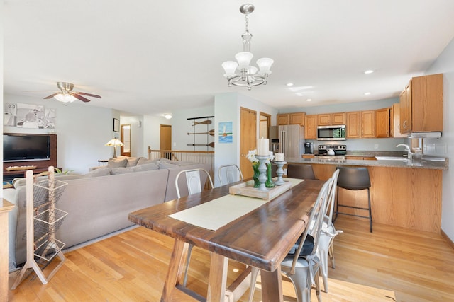 2800 9th Ave SW, Austin, MN 55912 - dining space featuring light wood-style floors, a chandelier, a ceiling fan, and recessed lighting