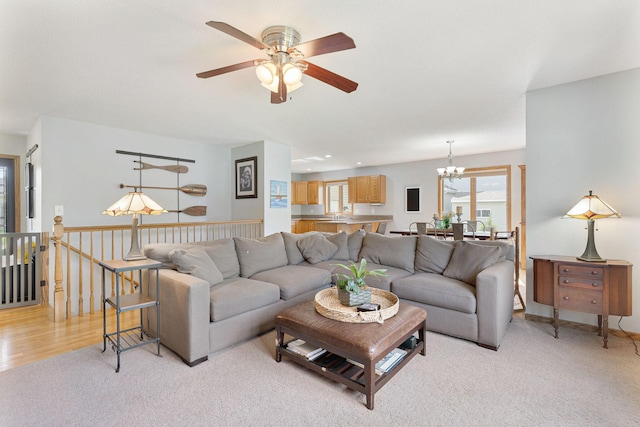 2800 9th Ave SW, Austin, MN 55912 - living room featuring a chandelier, a ceiling fan, and light carpet