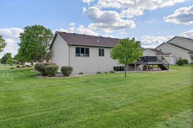 2800 9th Ave SW, Austin, MN 55912 - rear view of property with stairway, a deck, and a lawn