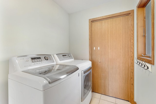 2800 9th Ave SW, Austin, MN 55912 - washroom with washing machine and clothes dryer and light tile patterned flooring