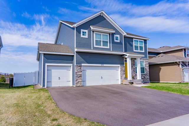 830 Foxglove Ter, Waconia, MN 55387 - view of front of house featuring driveway, stone siding, an attached garage, and a shingled roof
