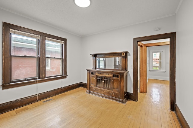 3400 Elliot Ave S, Minneapolis, MN 55407 - hall with wood-type flooring, crown molding, and baseboards