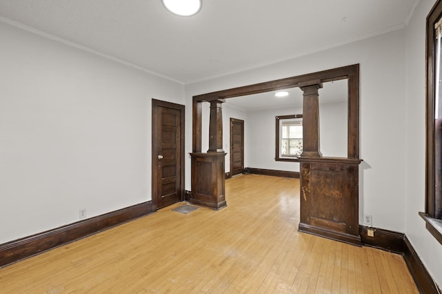 3400 Elliot Ave S, Minneapolis, MN 55407 - spare room with ornate columns, ornamental molding, light wood-type flooring, and baseboards