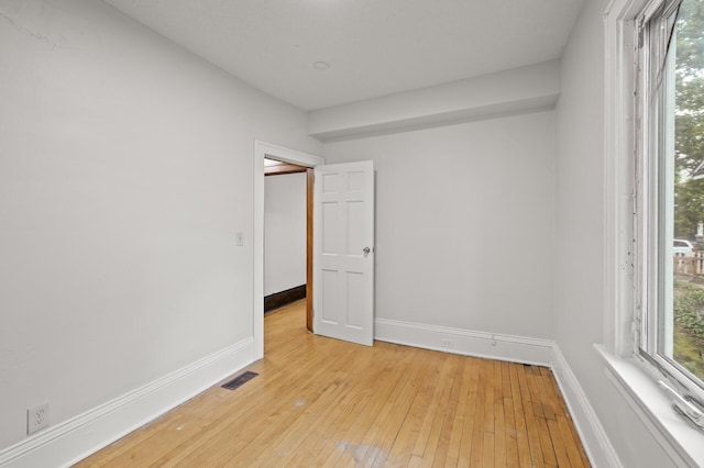 3400 Elliot Ave S, Minneapolis, MN 55407 - spare room with baseboards and light wood finished floors