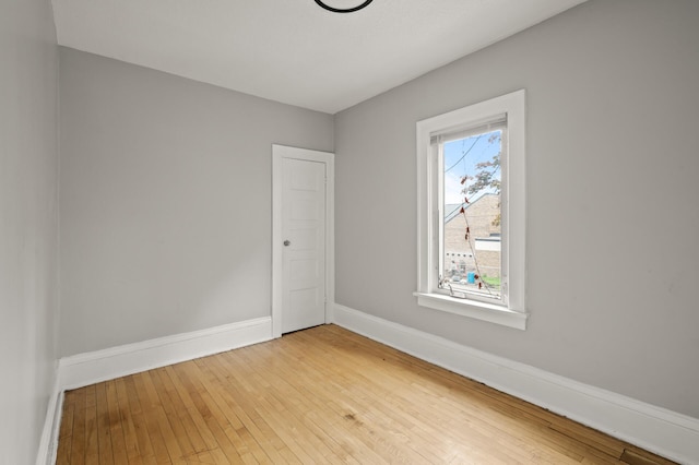 3400 Elliot Ave S, Minneapolis, MN 55407 - spare room featuring baseboards and hardwood / wood-style floors