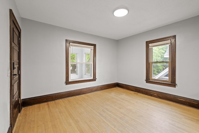 3400 Elliot Ave S, Minneapolis, MN 55407 - unfurnished room with light wood-style flooring and baseboards
