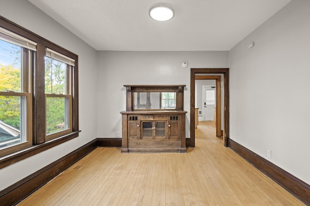 3400 Elliot Ave S, Minneapolis, MN 55407 - unfurnished living room featuring light wood-type flooring and baseboards