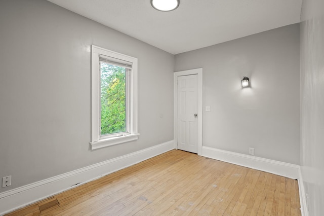 3400 Elliot Ave S, Minneapolis, MN 55407 - empty room featuring baseboards and hardwood / wood-style floors