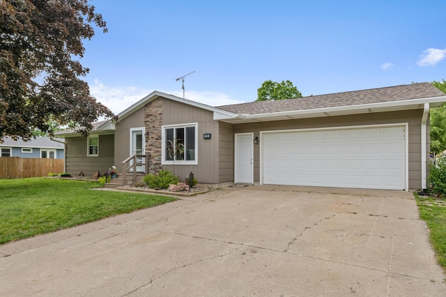 72 7th St, Cochrane, WI 54622 - view of front of property with concrete driveway, an attached garage, and roof with shingles