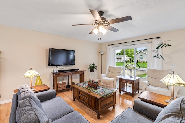 72 7th St, Cochrane, WI 54622 - living area with light wood-style floors and ceiling fan