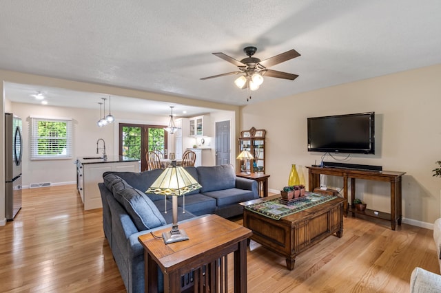 72 7th St, Cochrane, WI 54622 - living area featuring a ceiling fan and light wood-type flooring
