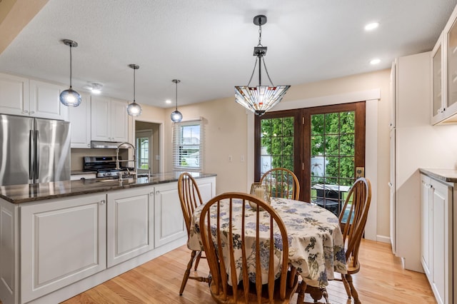 72 7th St, Cochrane, WI 54622 - dining room with light wood-type flooring and recessed lighting