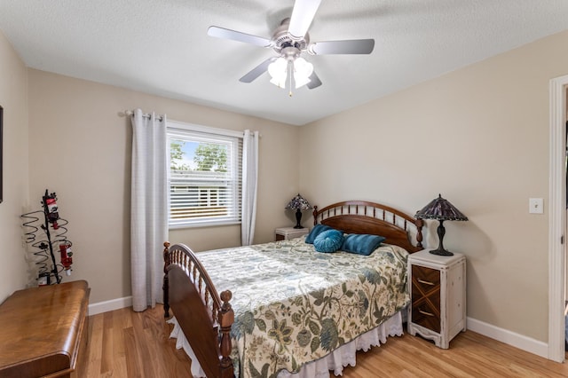 72 7th St, Cochrane, WI 54622 - bedroom with light wood-type flooring, ceiling fan, and a textured ceiling