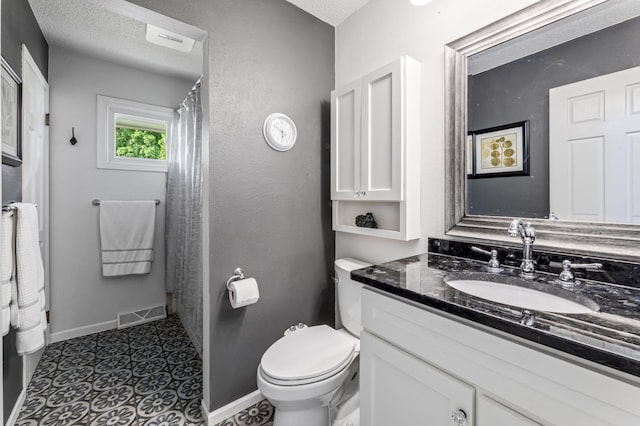 72 7th St, Cochrane, WI 54622 - full bath with vanity, a textured ceiling, a shower with shower curtain, and tile patterned floors