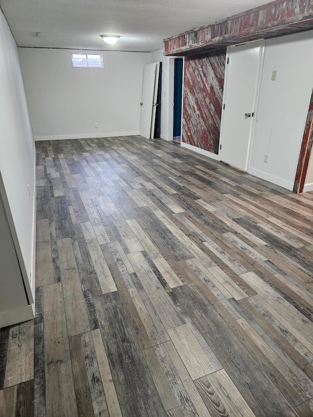 72 7th St, Cochrane, WI 54622 - basement featuring wood finished floors and a textured ceiling