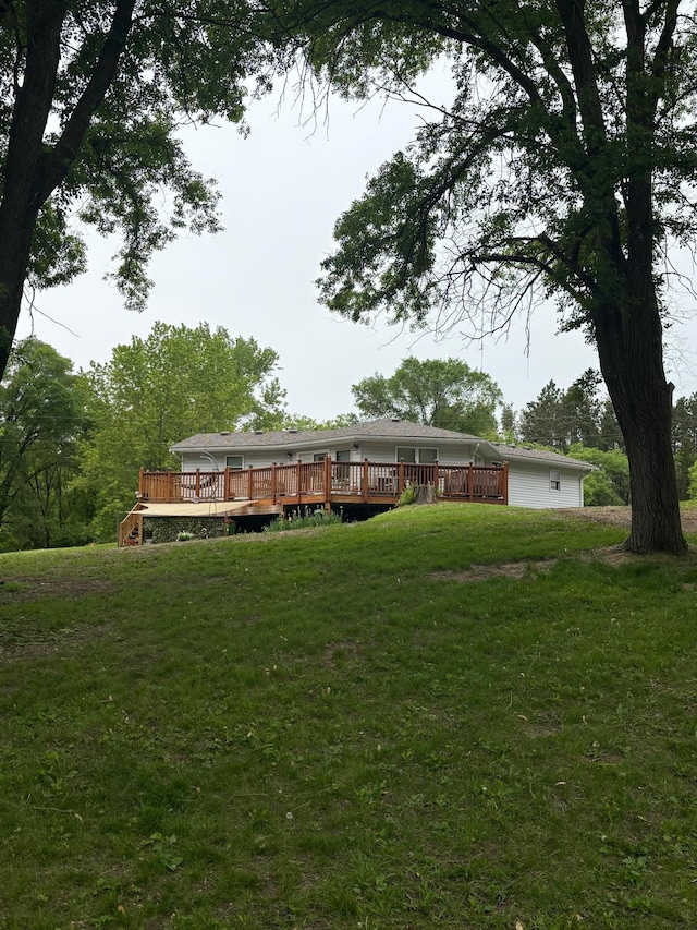 19146 Eaglewood Rd, Lynden Twp, MN 55320 - back of house featuring a deck and a yard