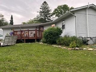 19146 Eaglewood Rd, Lynden Twp, MN 55320 - back of house with a wooden deck and a yard