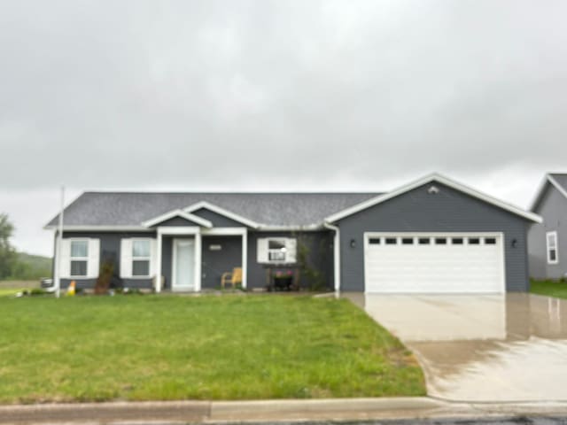 1108 11th Ave SE, Waseca, MN 56093 - single story home featuring an attached garage, a front yard, and driveway
