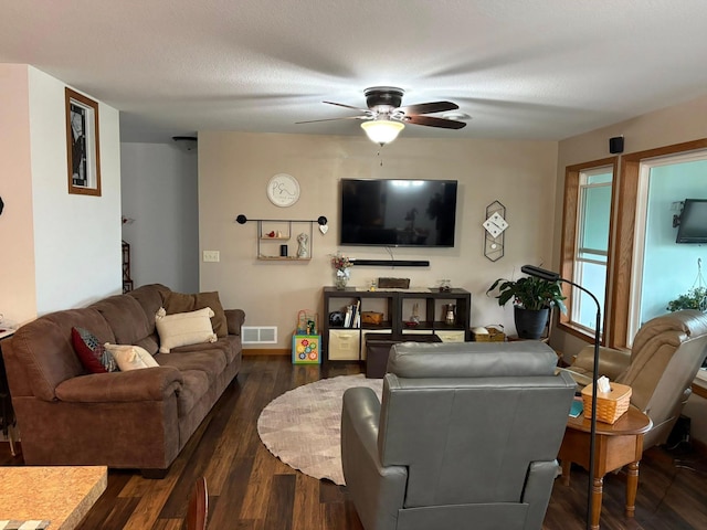 1108 11th Ave SE, Waseca, MN 56093 - living room featuring a ceiling fan, dark wood-style floors, and baseboards