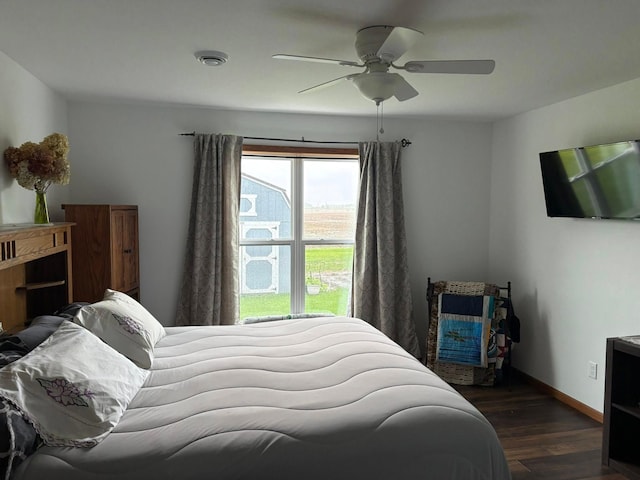 1108 11th Ave SE, Waseca, MN 56093 - bedroom featuring dark wood finished floors, a ceiling fan, and baseboards