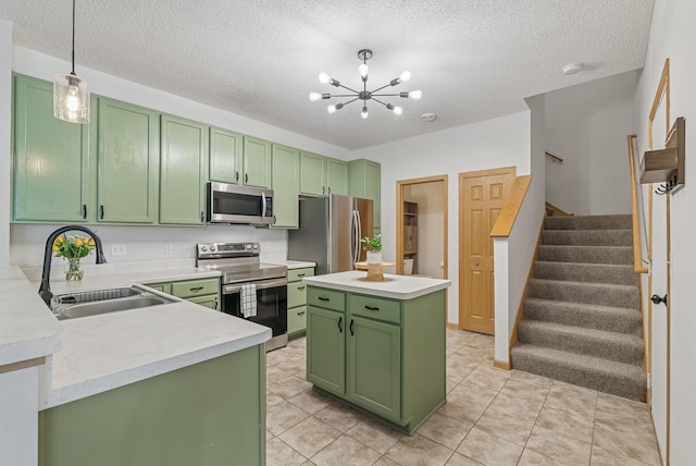 803 Willow Glen Ct, Buffalo, MN 55313 - kitchen featuring green cabinets, appliances with stainless steel finishes, light countertops, a textured ceiling, and a chandelier