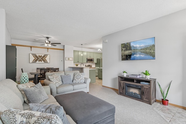 803 Willow Glen Ct, Buffalo, MN 55313 - living room featuring ceiling fan, light colored carpet, a textured ceiling, and a water view