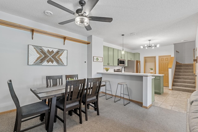 803 Willow Glen Ct, Buffalo, MN 55313 - dining room with light colored carpet, a chandelier, a textured ceiling, stairs, and a ceiling fan