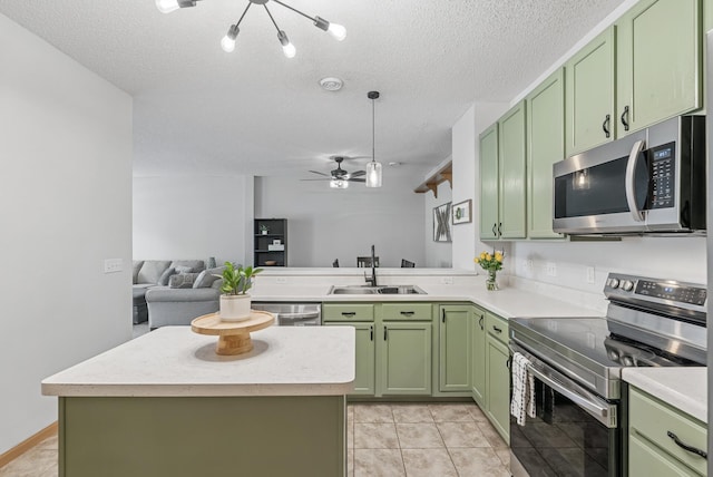 803 Willow Glen Ct, Buffalo, MN 55313 - kitchen featuring green cabinetry, appliances with stainless steel finishes, light countertops, and a textured ceiling