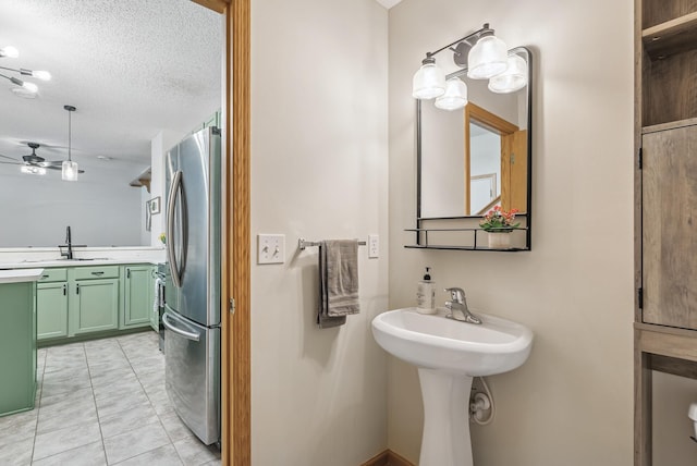 803 Willow Glen Ct, Buffalo, MN 55313 - bathroom featuring a textured ceiling, a ceiling fan, and tile patterned flooring