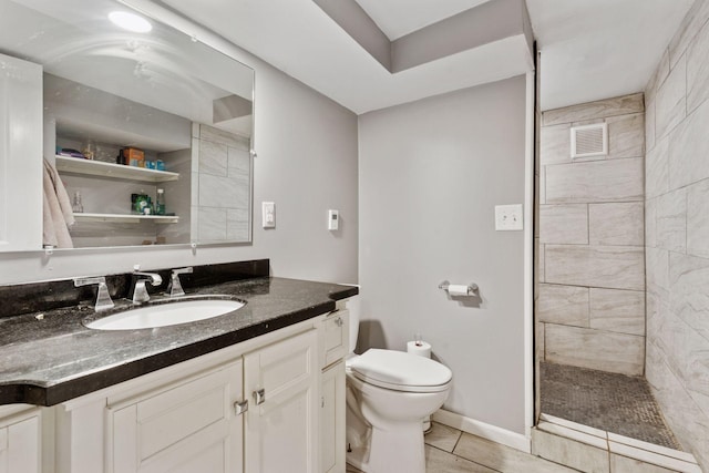 1104 21st Ave SE, Minneapolis, MN 55414 - bathroom with vanity, a tile shower, and tile patterned flooring