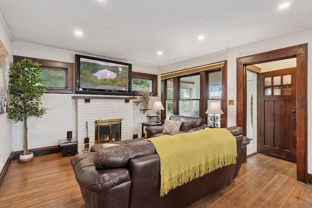 1104 21st Ave SE, Minneapolis, MN 55414 - living room with wood finished floors, a fireplace, and recessed lighting