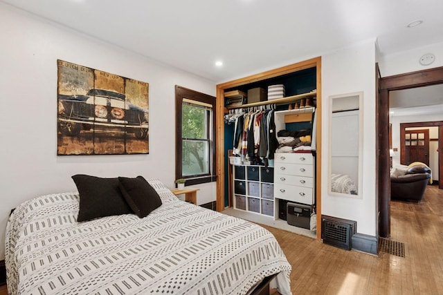 1104 21st Ave SE, Minneapolis, MN 55414 - bedroom with wood finished floors, recessed lighting, and a closet