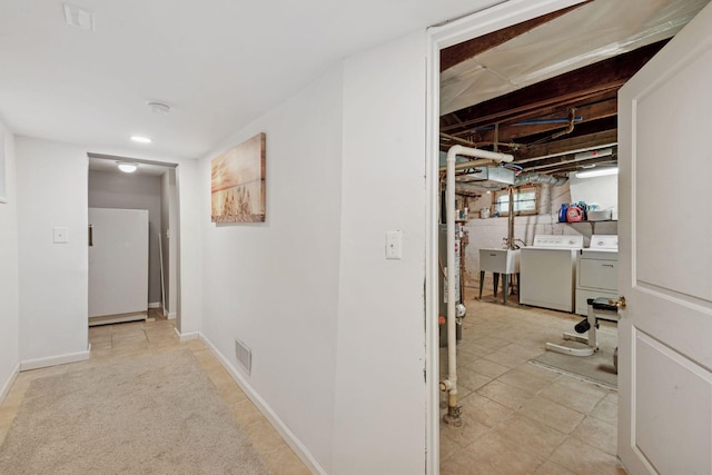 1104 21st Ave SE, Minneapolis, MN 55414 - hallway with washing machine and clothes dryer and a sink