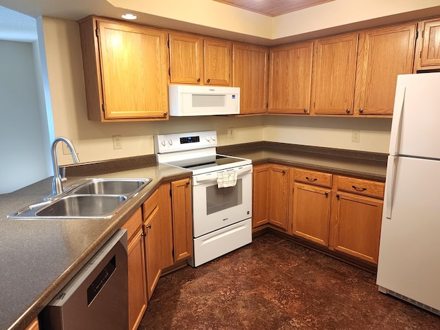 520 5th St SW Unit 318, Willmar, MN 56201 - kitchen with white appliances, a sink, dark countertops, and brown cabinetry