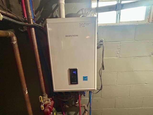 609 4th St NW, Wadena, MN 56482 - utility room with tankless water heater