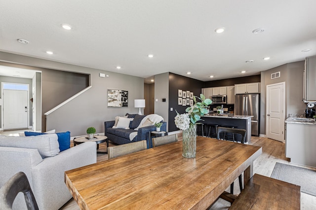 12719 Erskin St NE, Blaine, MN 55449 - dining room featuring recessed lighting and light wood finished floors